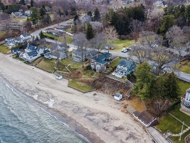 view of property location with waterfront with a beach