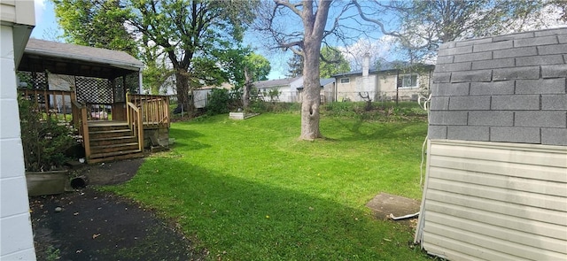 view of yard with a wooden deck