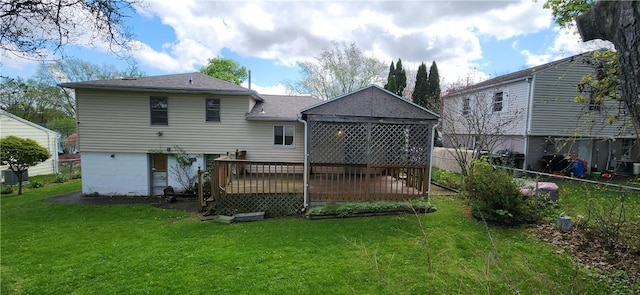 rear view of house featuring a wooden deck and a shingled roof