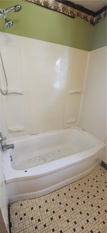 bathroom with shower / bath combination and tile patterned floors