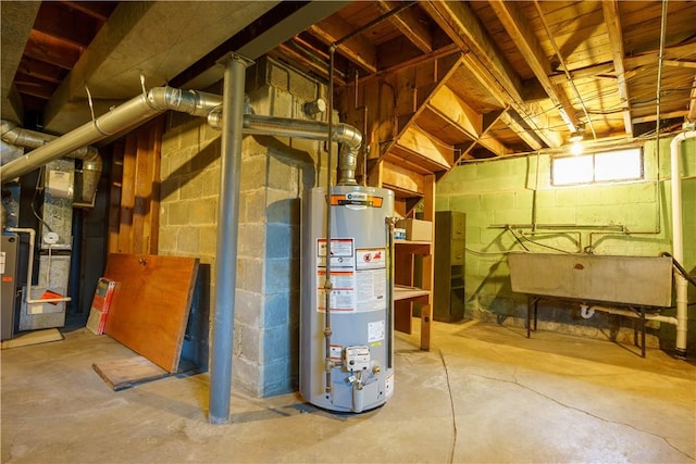 basement with water heater, heating unit, and a sink
