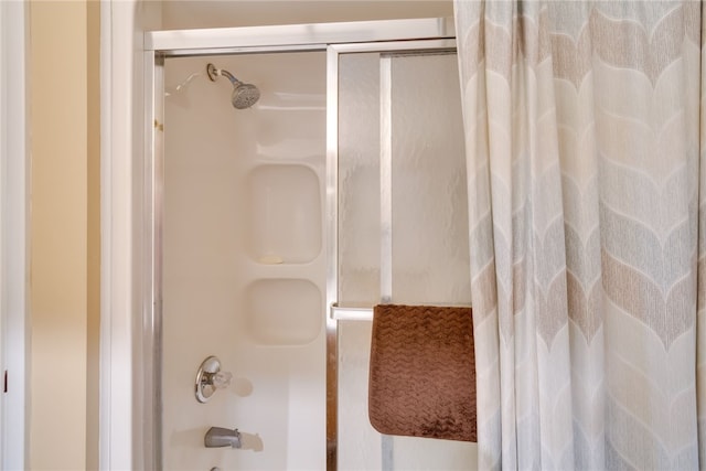 full bath with shower / bath combination with glass door