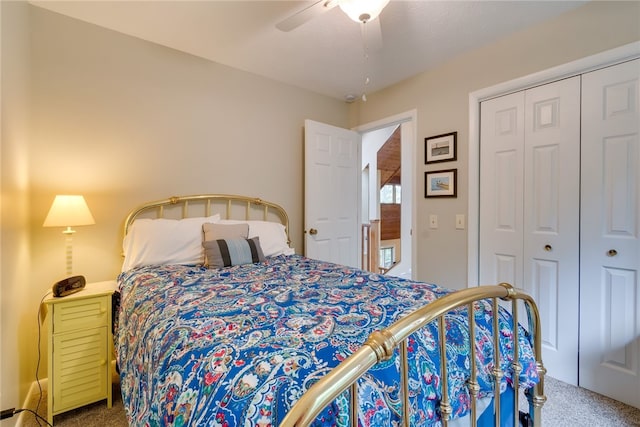 carpeted bedroom with a closet and a ceiling fan