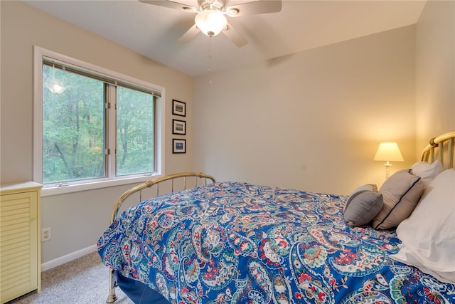bedroom with carpet floors, baseboards, and a ceiling fan