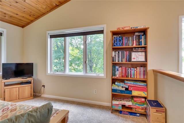 carpeted bedroom featuring lofted ceiling, wood ceiling, and baseboards