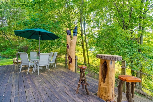 wooden terrace with outdoor dining space