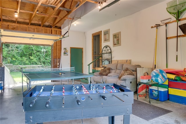 game room featuring unfinished concrete flooring