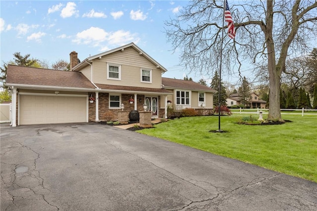 view of front of home with a chimney, an attached garage, asphalt driveway, brick siding, and a porch