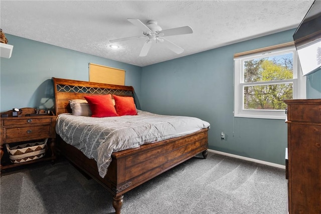 carpeted bedroom featuring a textured ceiling, baseboards, and ceiling fan