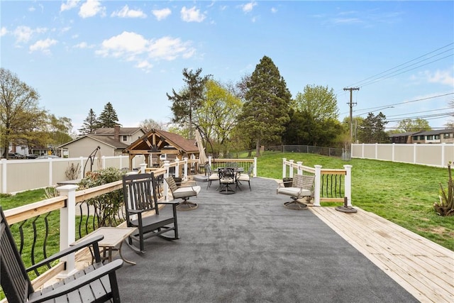 view of patio / terrace featuring outdoor dining area and a wooden deck