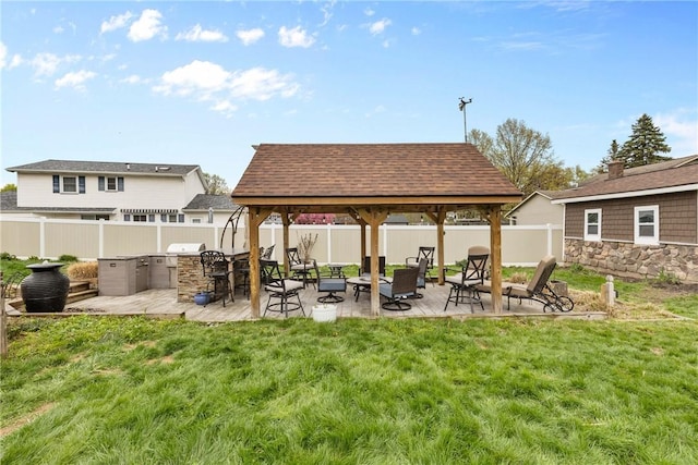 view of patio featuring a gazebo and exterior kitchen