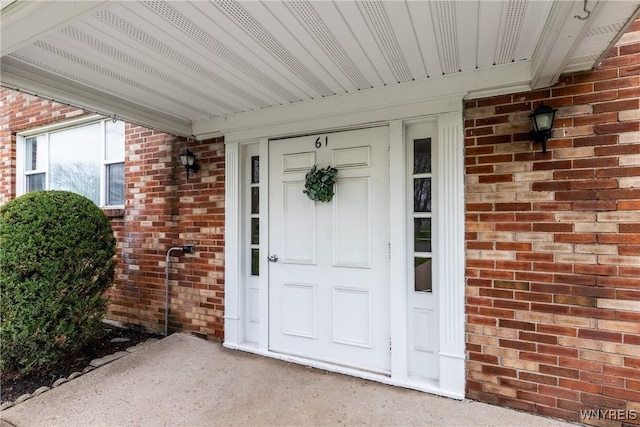property entrance with brick siding