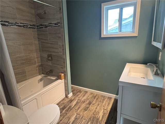 1270 W Belden Ave, Syracuse, NY 13204 - full bathroom with toilet, vanity, wood finished floors, shower / tub combination, and baseboards
