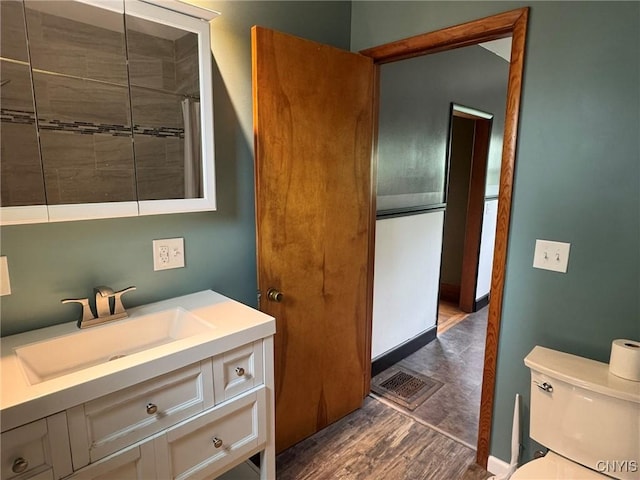 1270 W Belden Ave, Syracuse, NY 13204 - bathroom featuring wood finished floors, toilet, a shower with curtain, and vanity