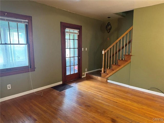 1270 W Belden Ave, Syracuse, NY 13204 - foyer with wood finished floors, stairs, and baseboards