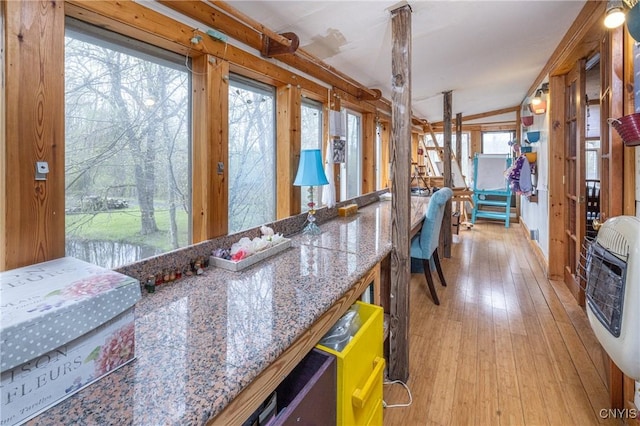 kitchen featuring light wood-style flooring and heating unit