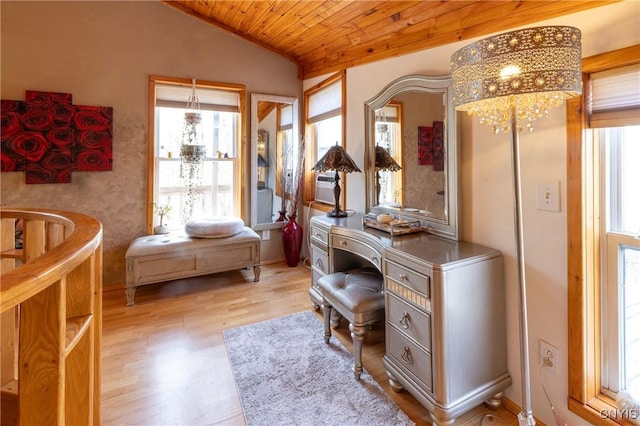 office area featuring vaulted ceiling, healthy amount of natural light, wooden ceiling, and wood finished floors