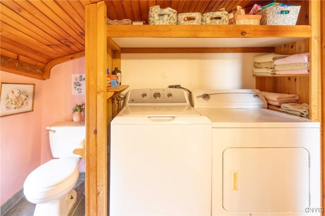 laundry area featuring separate washer and dryer and wood ceiling