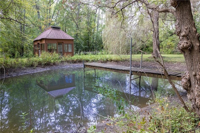 dock featuring a wooded view and a gazebo