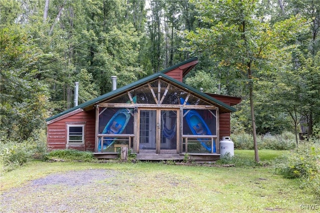 view of outdoor structure featuring a wooded view
