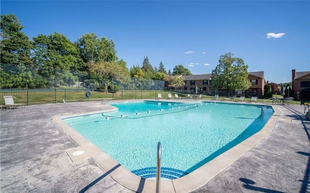 community pool featuring fence