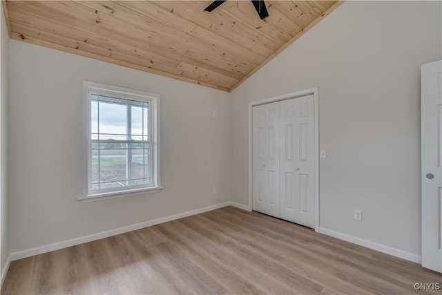 26593 State Route 283, Le Ray, NY 13601 - unfurnished bedroom with wooden ceiling, vaulted ceiling, light wood-style floors, a closet, and baseboards
