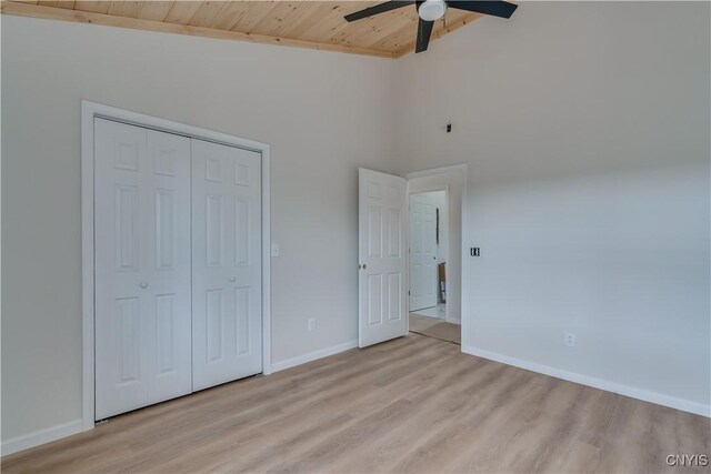 26593 State Route 283, Le Ray, NY 13601 - unfurnished bedroom with wood ceiling, light wood finished floors, baseboards, a closet, and a ceiling fan