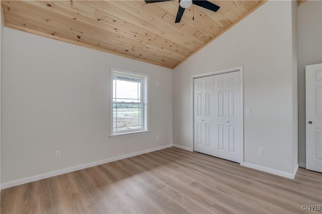 26593 State Route 283, Le Ray, NY 13601 - unfurnished bedroom featuring wood ceiling, lofted ceiling, light wood finished floors, baseboards, and a closet