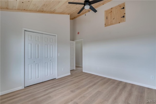 26593 State Route 283, Le Ray, NY 13601 - unfurnished bedroom with wood ceiling, light wood-style flooring, baseboards, a closet, and high vaulted ceiling