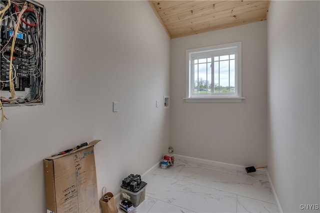 26593 State Route 283, Le Ray, NY 13601 - washroom featuring marble look tiles, baseboards, washer hookup, wood ceiling, and electric panel