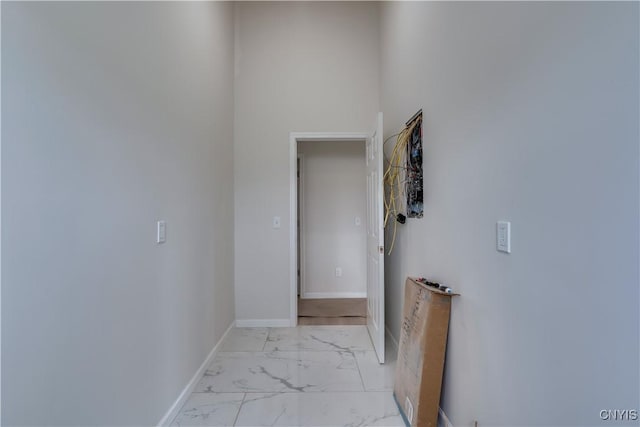 26593 State Route 283, Le Ray, NY 13601 - hall featuring light marble finish flooring and baseboards