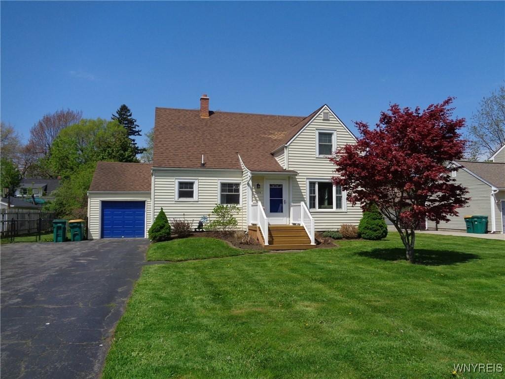 4274 Trailing Dr, Clarence, NY 14221 - cape cod home with asphalt driveway, a chimney, and a garage