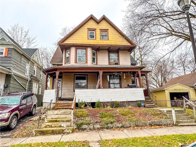 13 Brooklyn St, Rochester, NY 14613 - view of front of property with a porch, stairs, and an outbuilding