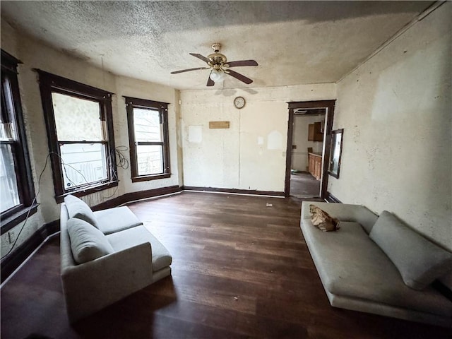 13 Brooklyn St, Rochester, NY 14613 - living room featuring a textured ceiling, wood finished floors, a ceiling fan, and baseboards