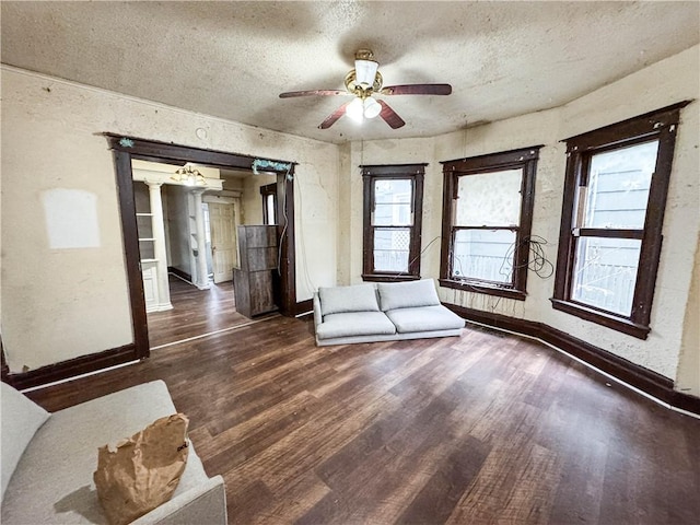 13 Brooklyn St, Rochester, NY 14613 - unfurnished living room with wood finished floors, ceiling fan, baseboards, and a textured ceiling