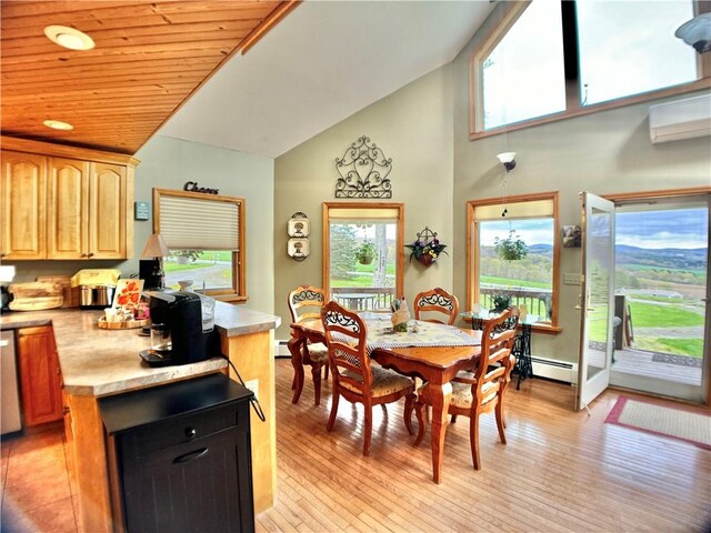 575 Harper Rd, Harpersfield, NY 13786 - dining area featuring light wood-type flooring, a baseboard radiator, and high vaulted ceiling