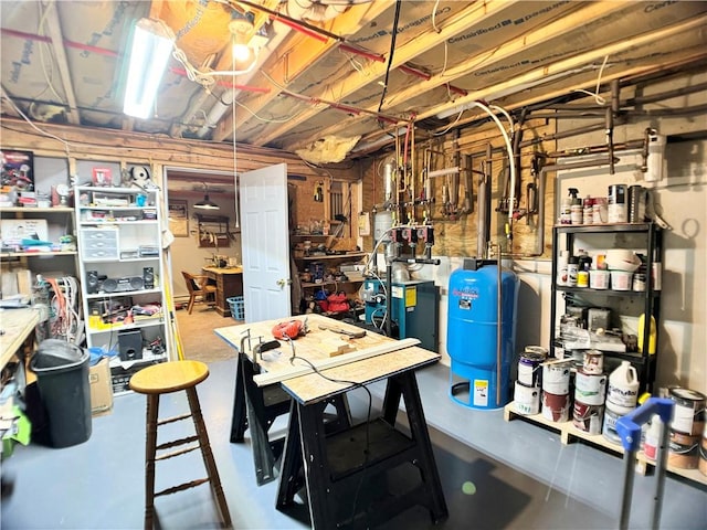 575 Harper Rd, Harpersfield, NY 13786 - unfinished below grade area with a water pressure tank and a heating unit
