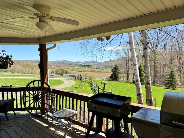 575 Harper Rd, Harpersfield, NY 13786 - wooden terrace featuring ceiling fan, a lawn, a mountain view, and a view of countryside