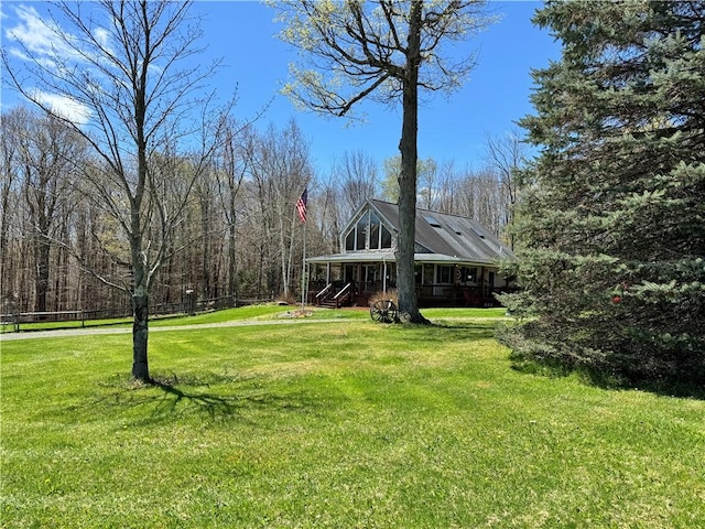 575 Harper Rd, Harpersfield, NY 13786 - view of green lawn with covered porch and a forest view