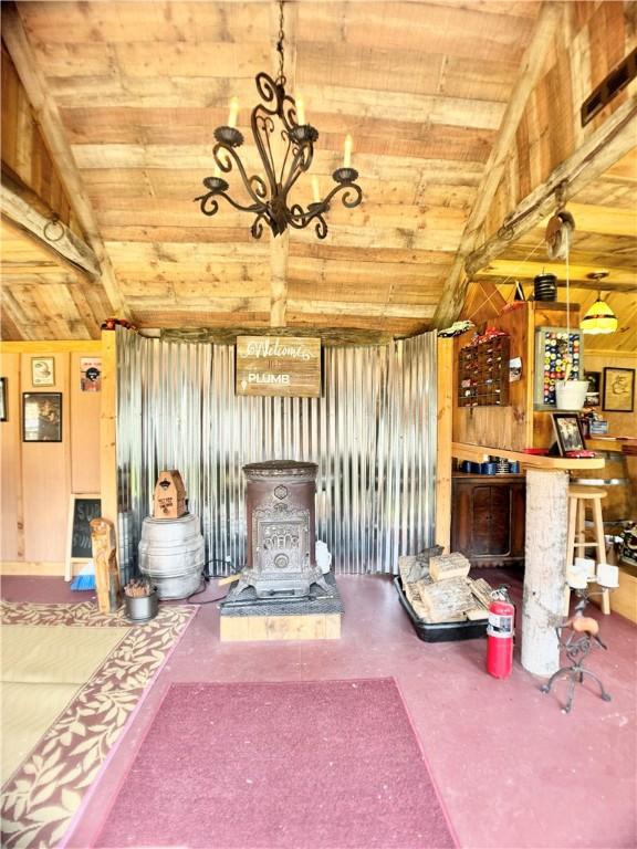 575 Harper Rd, Harpersfield, NY 13786 - living area featuring a wood stove, wood ceiling, and wood walls