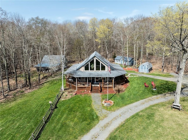 575 Harper Rd, Harpersfield, NY 13786 - rear view of property with covered porch, a yard, an outdoor structure, and a storage shed