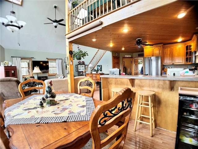 575 Harper Rd, Harpersfield, NY 13786 - dining space featuring a ceiling fan, wine cooler, stairs, light wood-style floors, and recessed lighting
