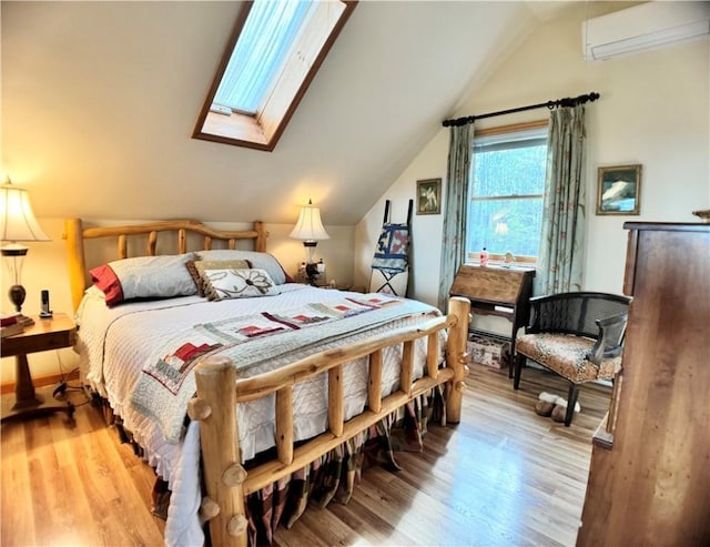 575 Harper Rd, Harpersfield, NY 13786 - bedroom featuring a wall mounted air conditioner, vaulted ceiling, light wood-style flooring, and a skylight