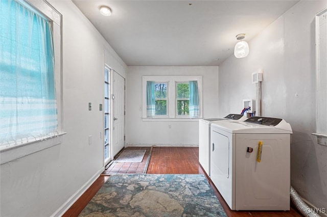 laundry room featuring washing machine and dryer and wood finished floors