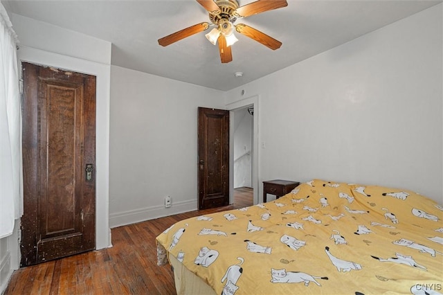 bedroom featuring hardwood / wood-style flooring, baseboards, and ceiling fan