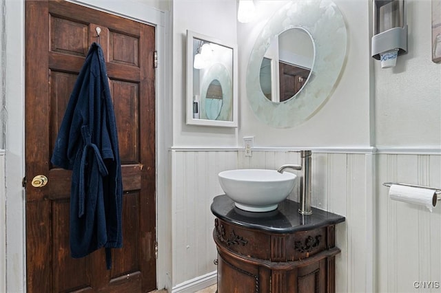 bathroom with wainscoting and vanity