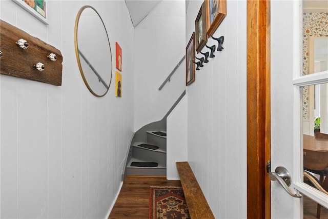 doorway to outside featuring wood finished floors and stairs