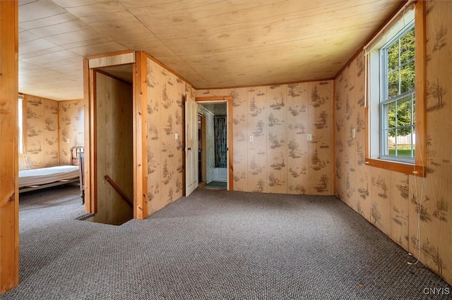 7709 State Highway 28, Exeter, NY 13439 - empty room featuring carpet floors, wallpapered walls, and wood ceiling
