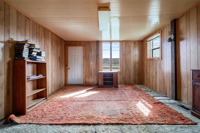 7709 State Highway 28, Exeter, NY 13439 - carpeted spare room with wooden walls and wood ceiling