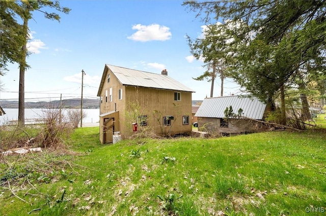 7709 State Highway 28, Exeter, NY 13439 - rear view of house featuring a water view